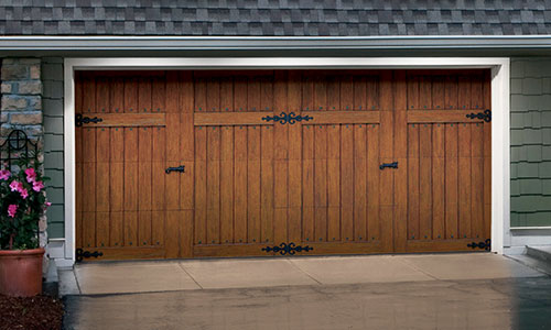A beautiful garage door, like this brown wooden one, can really boost your home’s curb appeal — and resale value.